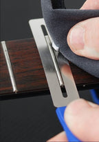 Music Nomad MN225 GRIP contouring fretboard guards for guitar, with black rubberized grip and precise shaping for fretboard protection.