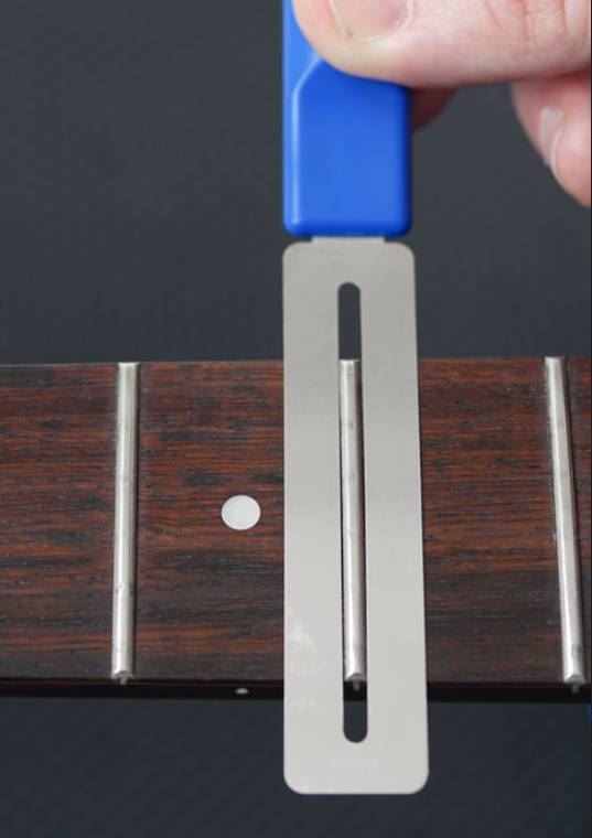 Music Nomad MN225 GRIP contouring fretboard guards for guitars, shown in black with textured grip surface, designed for precise fretboard protection.