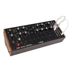 Moog DFAM semi-modular analog percussion synthesizer with drum pads and control knobs, designed for expressive rhythm creation.