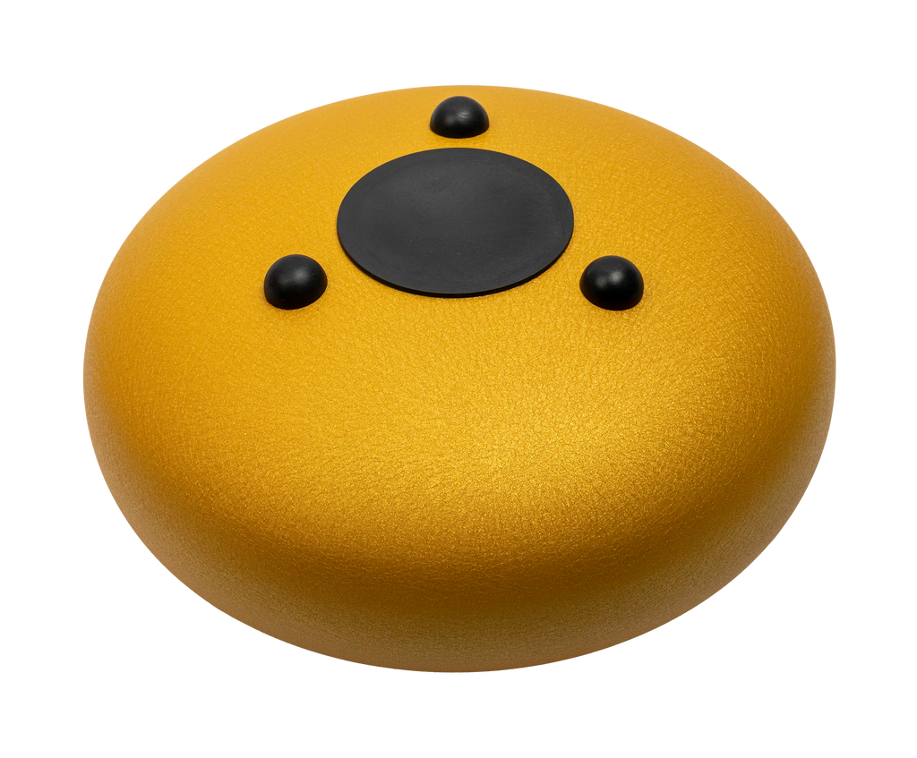 Mano Percussion MPC42GD gold 12-tongue drum viewed from the back, showcasing its polished surface and tuning holes.