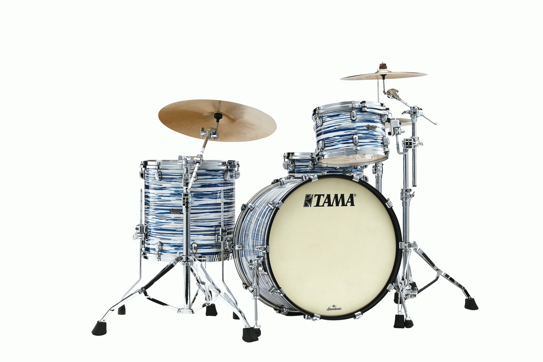 Tama Starclassic Maple 22-inch 3-piece drum kit shell pack in blue and white oyster finish with toms and bass drum visible