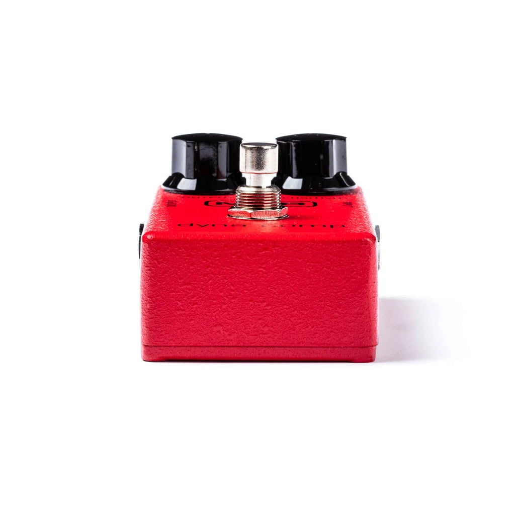 MXR Dyna Comp guitar effects pedal with controls and connection jacks, used for dynamic compression in electric guitar setups.