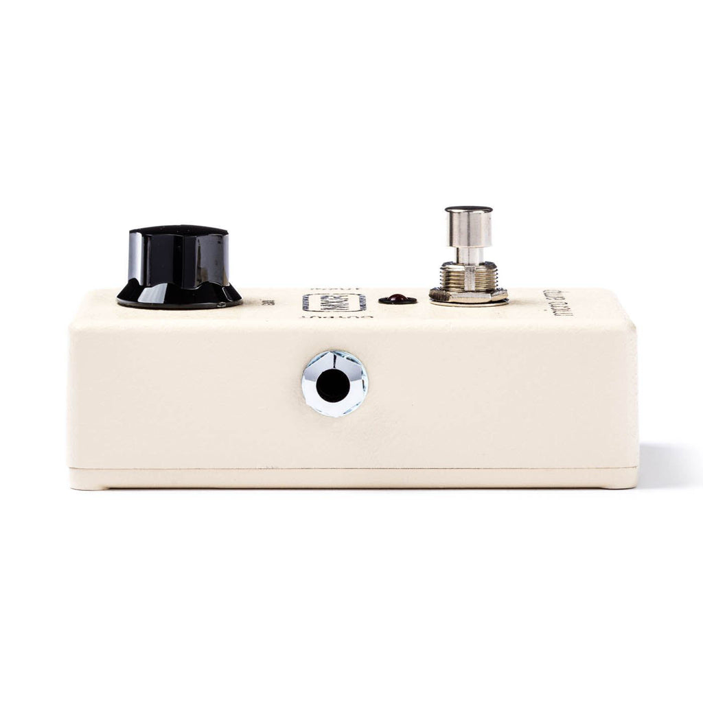 Close-up of MXR Micro Amp guitar effects pedal showing its silver casing and control knob for boosting sound.