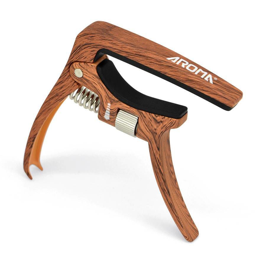 Aroma AC30 Wood Finish guitar capo on an acoustic guitar neck, showcasing its wooden tonebar design and secure grip.