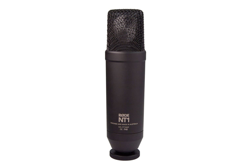 Rode NT1 Studio Condenser Microphone Kit with microphone, shock mount, and accessories on a recording studio setup.