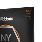 D'Addario NYXL1356W Nickel Wound Electric Guitar Strings set, medium wound 3rd string, 13-56 gauge, arranged on a guitar bridge.