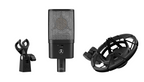 Austrian Audio OC16 studio microphone with spider mount, featuring a sleek black design and professional recording setup.
