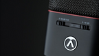 Pair of Austrian Audio OC18 studio microphones with spider mounts and stereo mount for professional recording.
