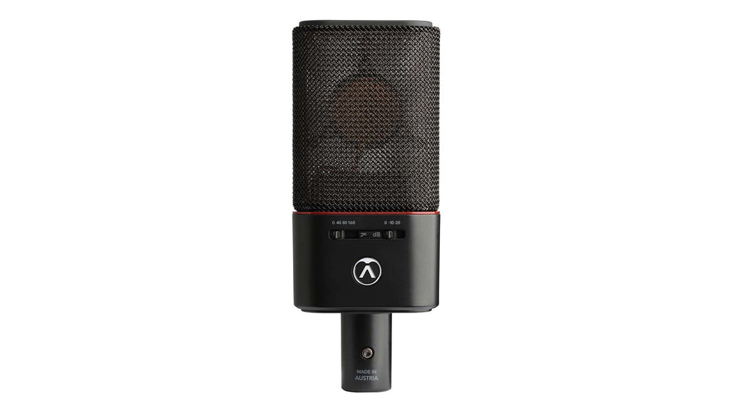 Austrian Audio OC18 studio microphones in a live stereo pair setup, featuring dual microphone capsules and professional audio equipment.