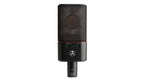 Austrian Audio OC18 studio microphones in a live stereo pair setup, featuring dual microphone capsules and professional audio equipment.