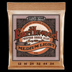 Ernie Ball Earthwood medium light phosphor bronze acoustic guitar strings, showing a close-up of the string set on a guitar.