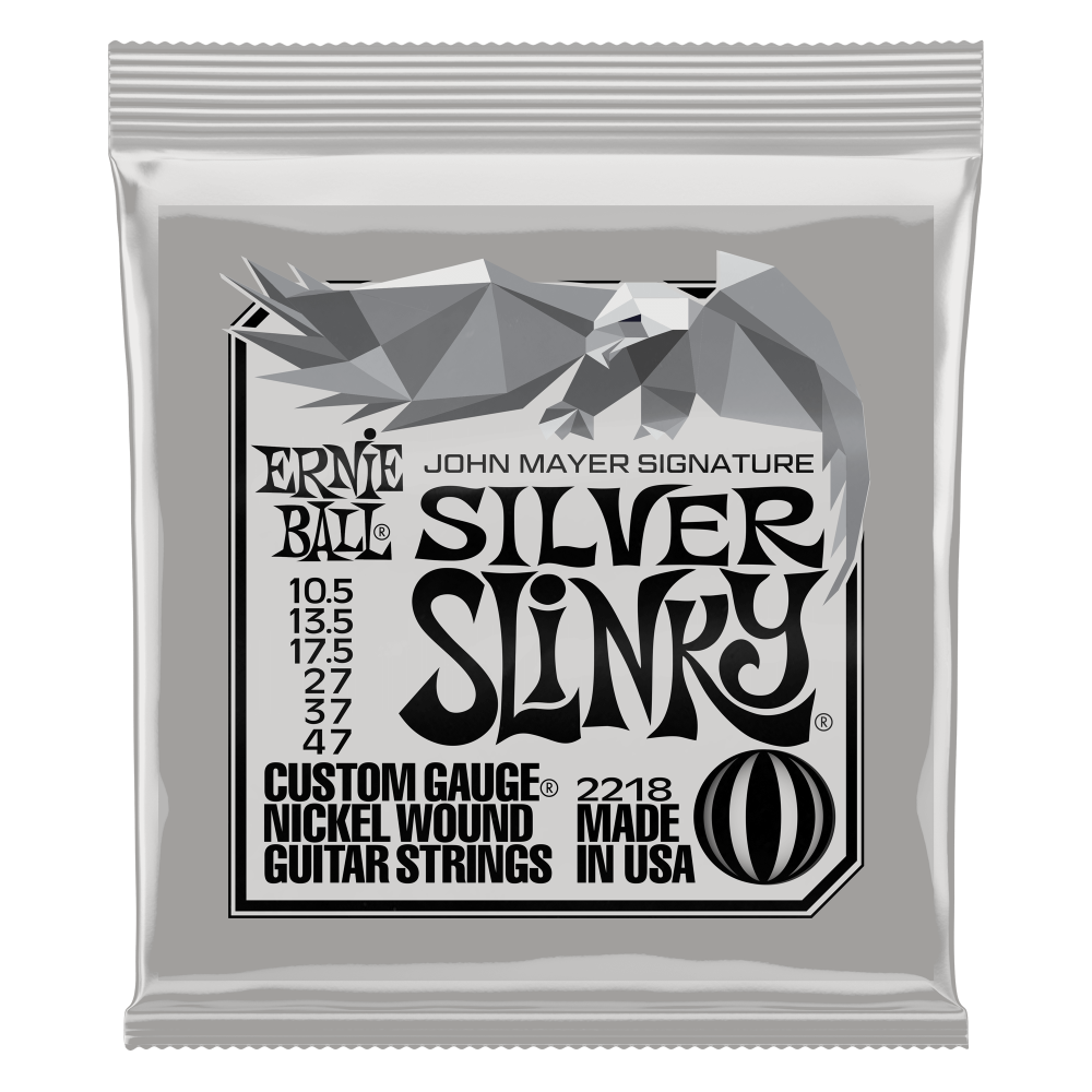 Ernie Ball John Mayer Silver Slinky electric guitar strings, 10.5-47 gauge, shown on a guitar for vibrant sound and playability.