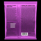 Ernie Ball Power Slinky Nickel Wound Electric Bass Strings shown on a bass guitar, highlighting the string packaging and branding.