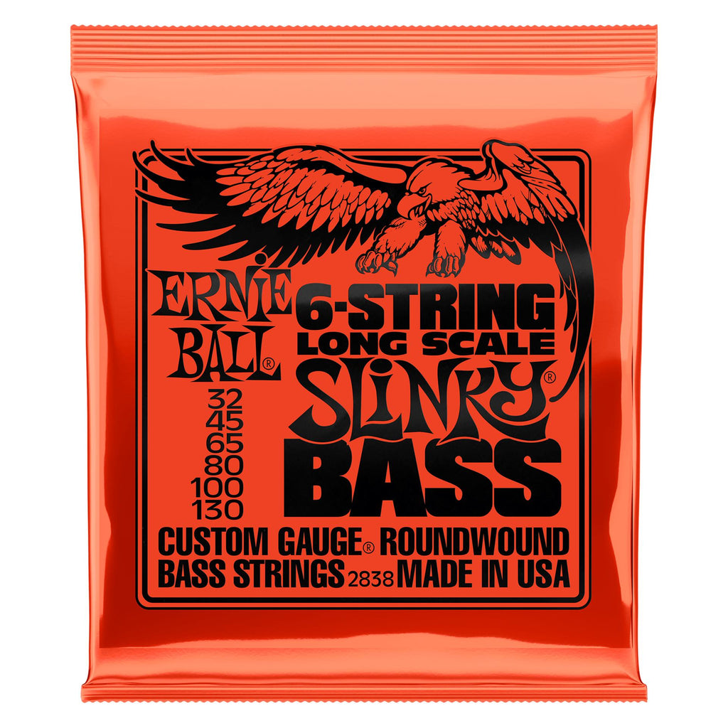 Ernie Ball Slinky long scale 6-string nickel wound electric bass strings laid out on a white background