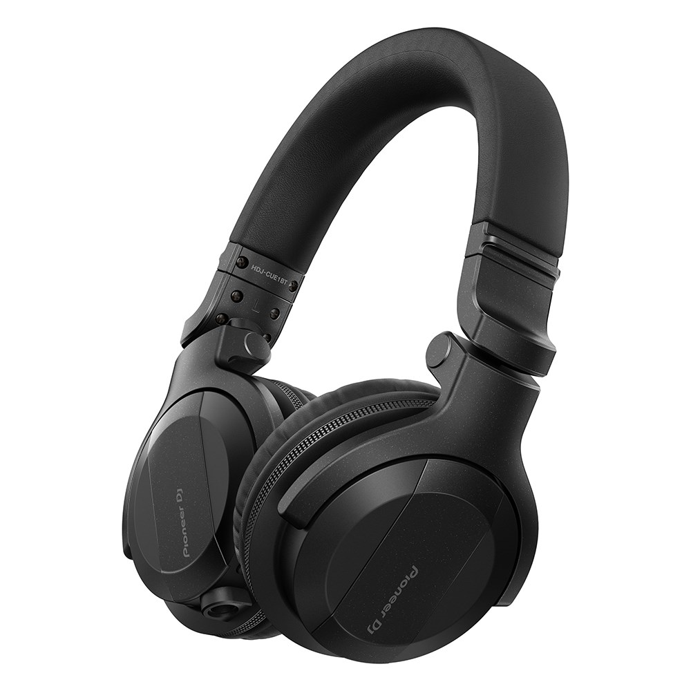 Pioneer HDJ-CUE1BT-K black Bluetooth monitoring headphones on a flat surface, showcasing sleek design and comfortable earcups.