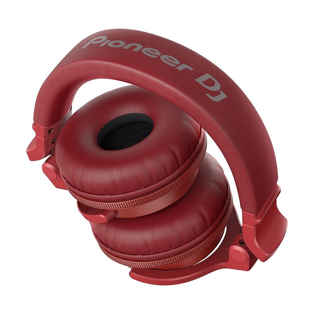 Pioneer HDJ-CUE1BT-R red Bluetooth monitoring headphones with adjustable headband and cushioned ear pads.