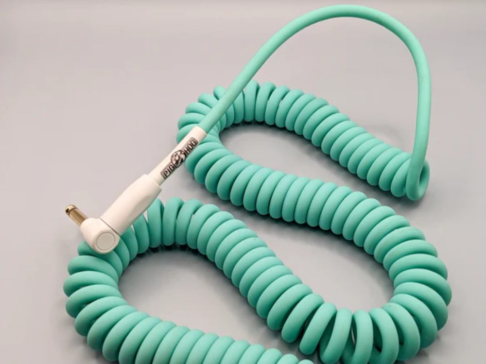 Pig Hog 30 ft seafoam green guitar instrument cable, half coil design, high-quality lead for electric guitars.