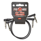 Two Pig Hog Lil' Pigs low profile 1ft guitar patch cables in black, designed for easy connection and minimal space.