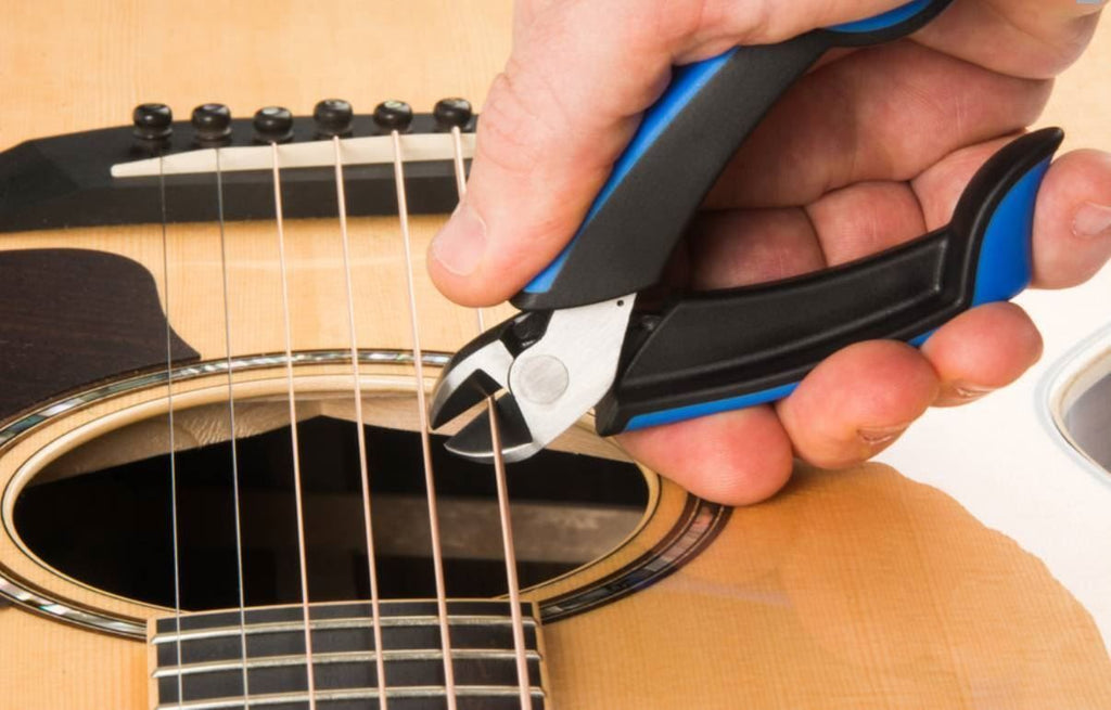 Music Nomad MN226 GRIP Cutter premium guitar string cutter with ergonomic handle and sharp cutting blades for precise string trimming.