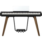 Casio Privia PX-S7000 black portable digital piano with matching stand, featuring sleek design and full-sized keys.