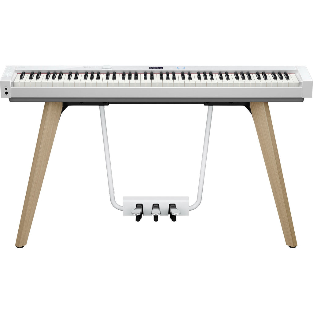 Casio Privia PX-S7000 portable digital piano with stand in white, featuring a sleek design and full-size keys.