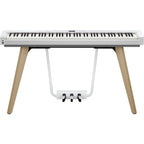 Casio Privia PX-S7000 portable digital piano with stand in white, featuring a sleek design and full-size keys.