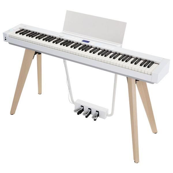 Casio Privia PX-S7000 portable digital piano with stand in white, showing the sleek design and keyboard keys.
