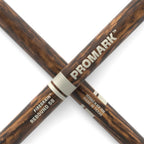 ProMark Rebound 5B FireGrain drumsticks with natural wood finish and grip, designed for drummers and percussionists.