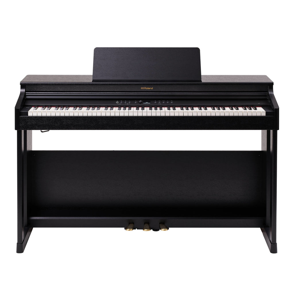 Roland RP-701 black digital piano with sleek design, multiple keys, and control panel in a modern home setting.