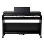 Roland RP-701 black digital piano with sleek design, multiple keys, and control panel in a modern home setting.