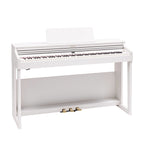 Roland RP-701 White digital piano, home use model with sleek design and full keyboard, close-up of keys and control panel.