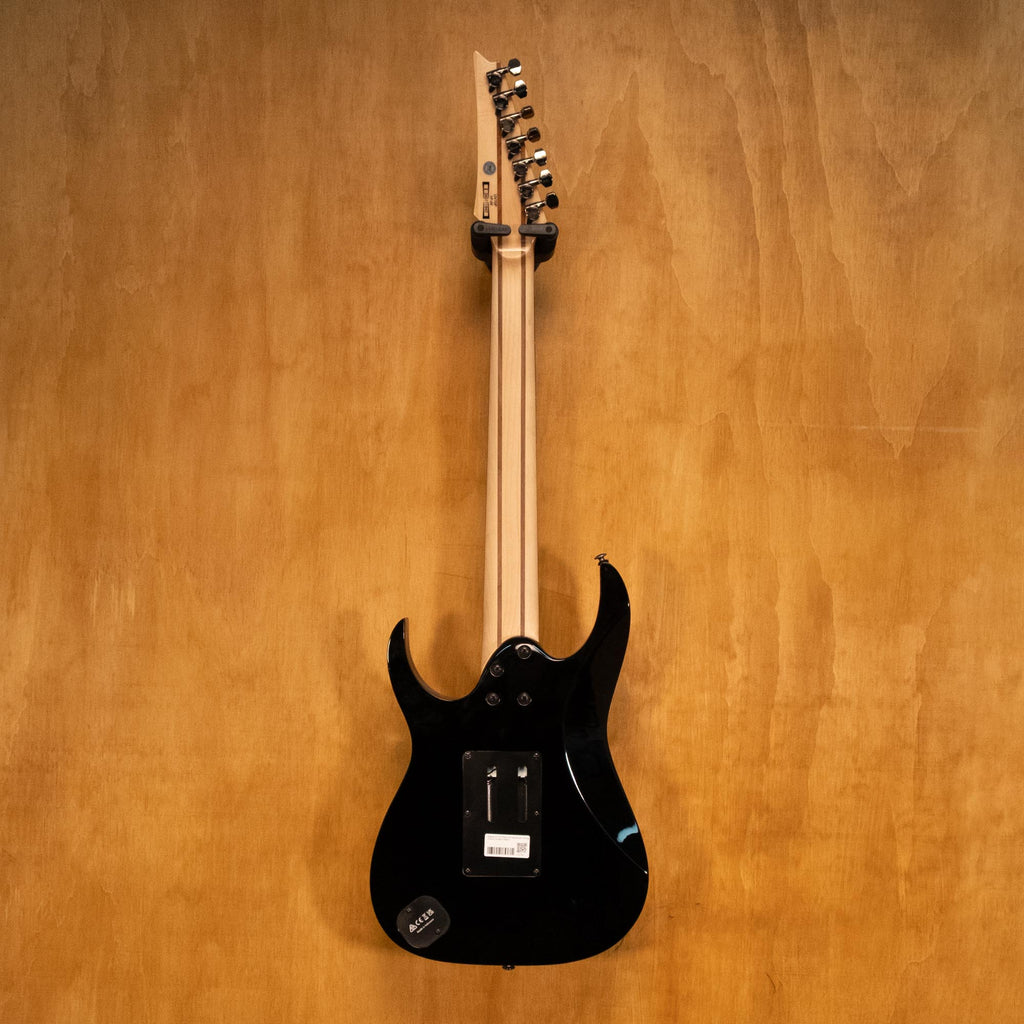 Rear view of IBANEZ UV70P Steve Vai 7-string electric guitar in black, showcasing the back and hardware details.