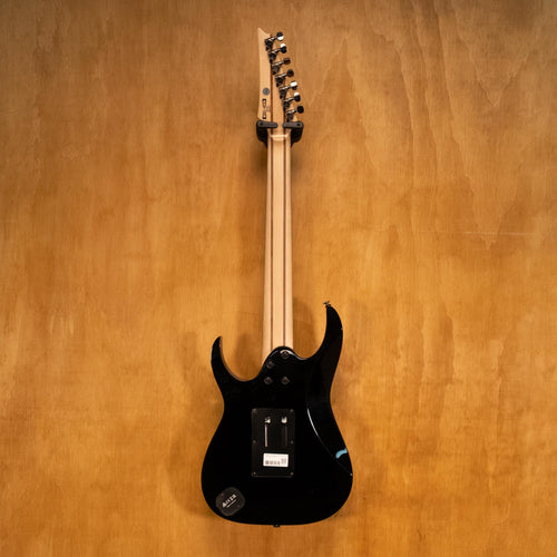 Rear view of IBANEZ UV70P Steve Vai 7-string electric guitar in black, showcasing the back and hardware details.