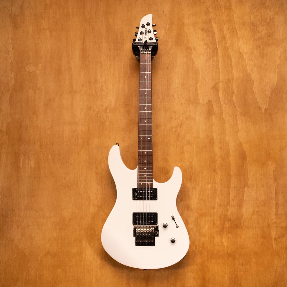 Preloved Yamaha RGX420DZ electric guitar with JB/59 SD pickups, shown in a fitted hardbag, highlighting its sleek design.