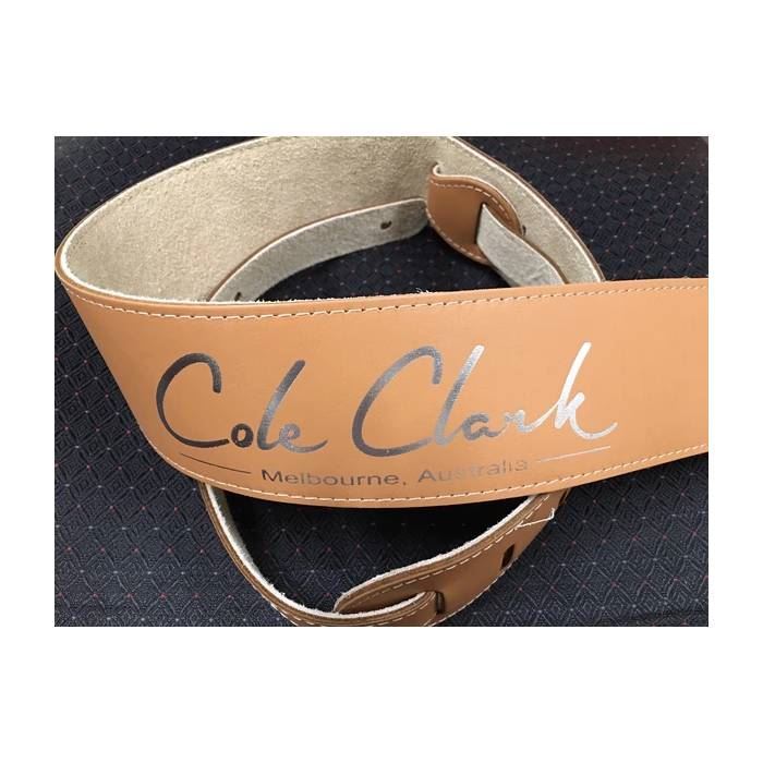 Tan leather guitar strap by Cole Clark featuring adjustable design and stitching details for comfortable playing.