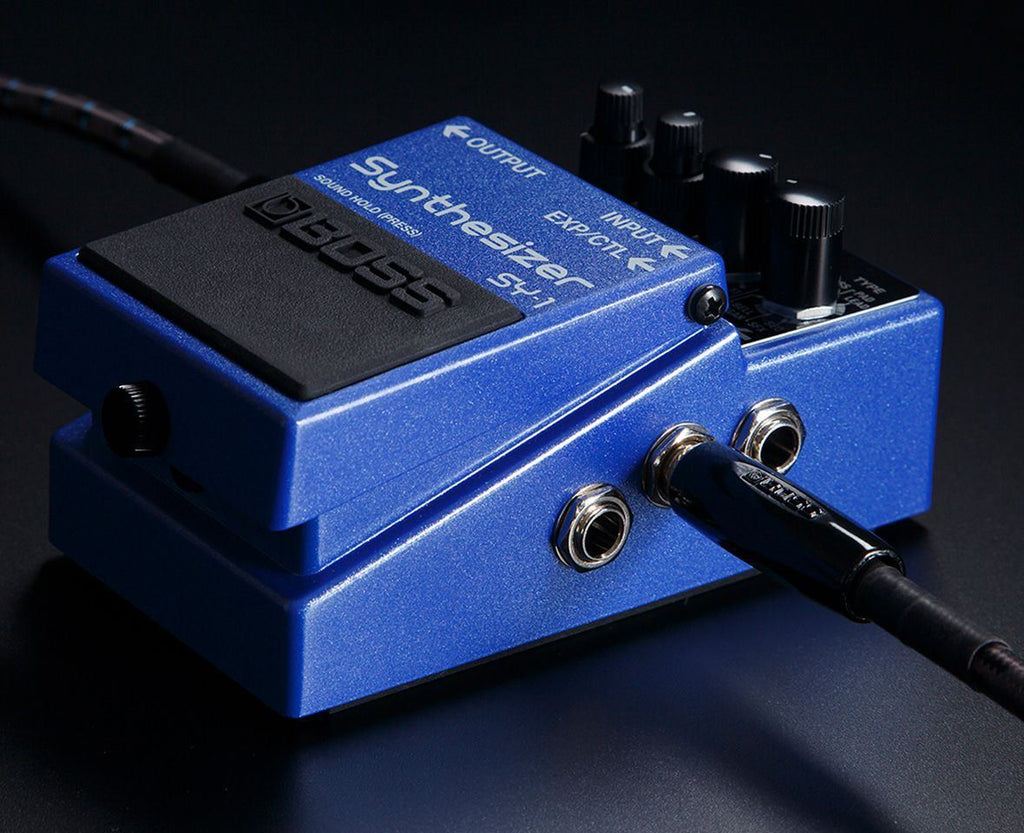 BOSS SY-1 Synthesizer Effects Pedal with various knobs and input/output jacks, used for creating unique synthesizer sounds