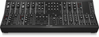 Behringer Rd-8 MkII analog drum machine synthesizer keyboard with control knobs and digital interface.