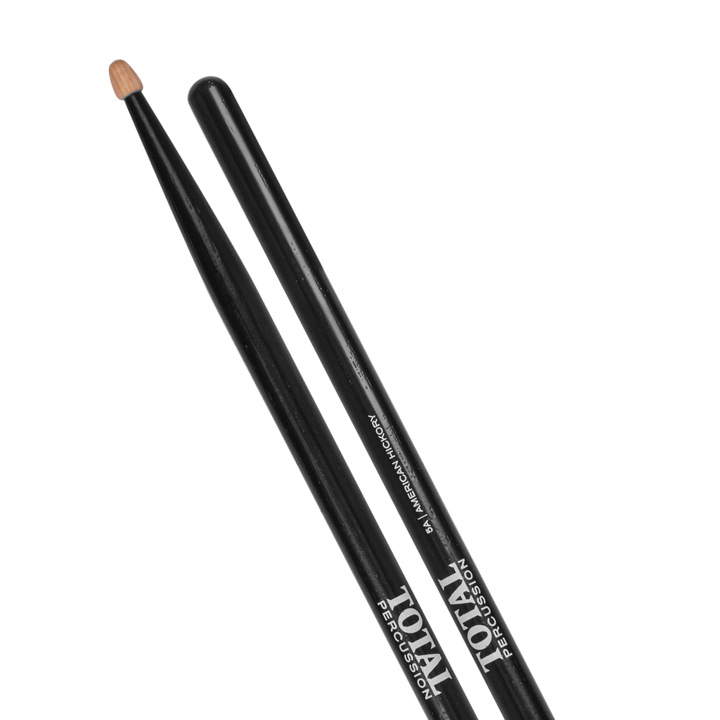 Total Percussion 5A drumsticks in black with wood tips, shown with one stick resting on a drum.