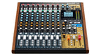 Tascam Model 12 digital multitrack recorder with integrated USB audio interface and control panel, showing various input knobs and connections.