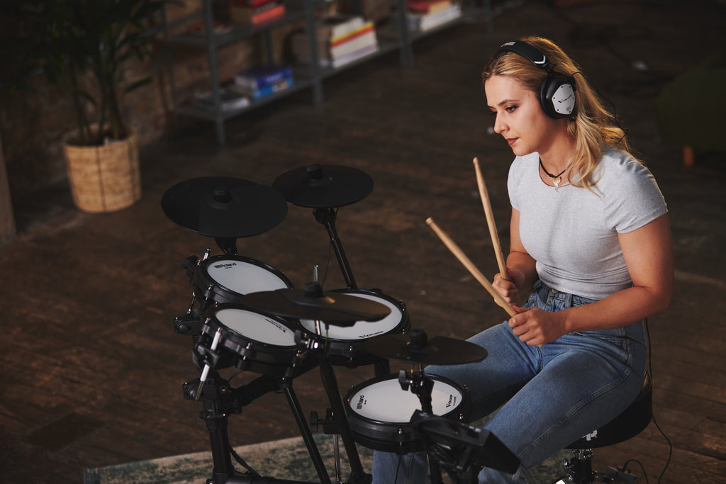 Roland TD-07DMK2 V-Drums electronic drum kit with mesh pads, cymbals, and drum module, set up on a stand for playing.