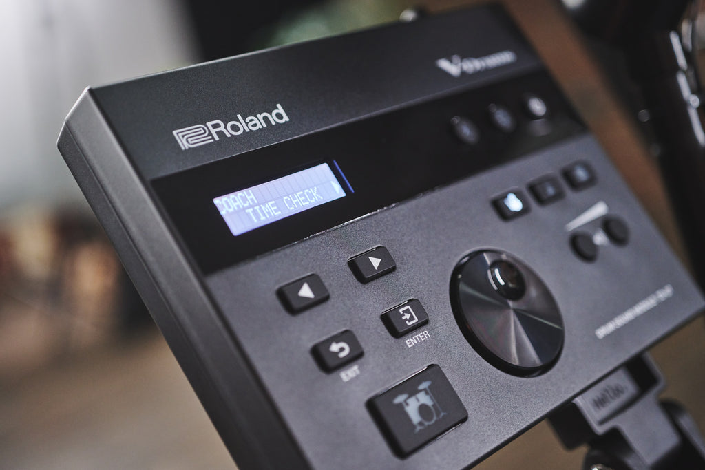 Roland TD-07DMK2 V-Drums electronic drum kit with mesh snare, cymbals, and drum modules, set up for playing.