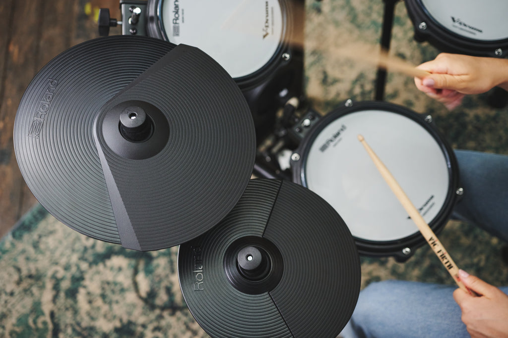 Roland TD-07DMK2 V-Drums electronic drum kit with drum pads, cymbals, and control module on a stand, ready for play.