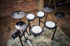 Roland TD-07KV2 V-Drums electronic drum kit with mesh snare, toms, cymbals, and electronic module on a stand.