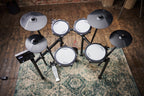 Roland TD-07KV2 V-Drums electronic drum kit with mesh snare, cymbals, and compact drum pads on a stand.