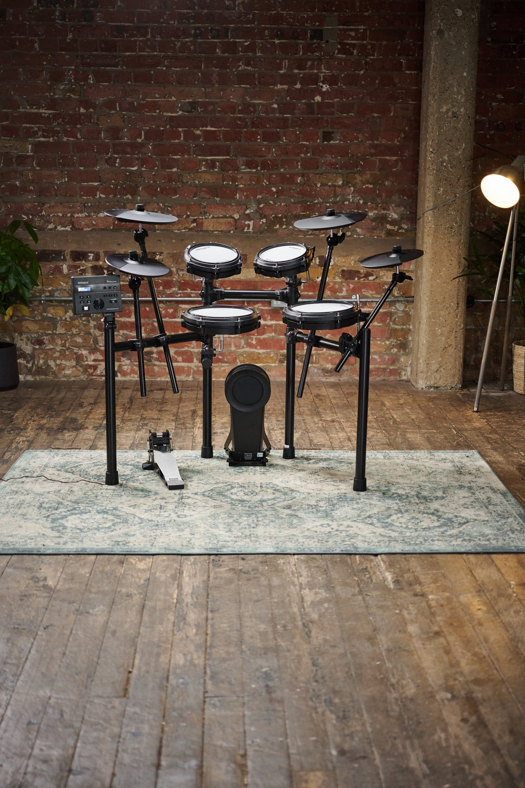 Roland TD-07KV2 V-Drums electronic drum kit with mesh snare and cymbals, compact setup for drumming practice and performances.