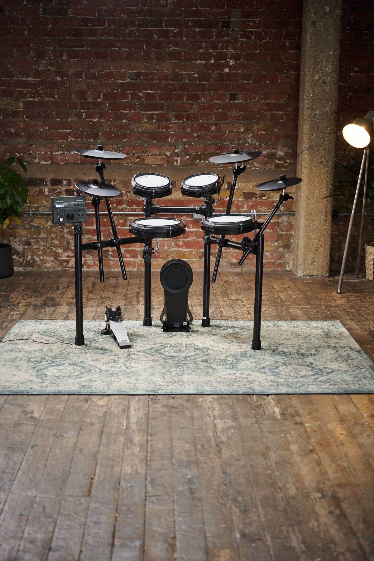 Roland TD-07KV2 V-Drums electronic drum kit with mesh snare and cymbals, compact setup for drumming practice and performances.