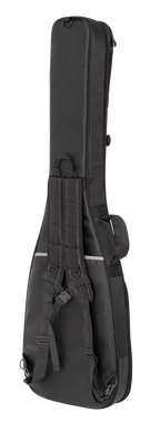 Xtreme Xtreme Pro Premium Deluxe bass guitar gig bag with padded straps and side handle, viewed from back-left showing storage pockets.