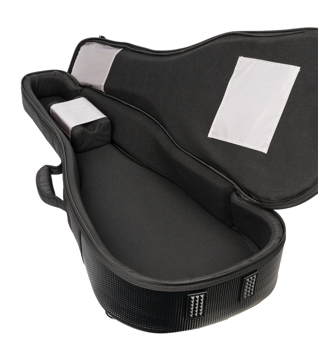 Open view of Xtreme Pro Premium Deluxe 4/4 Classic/Folk Guitar Bag showing padded interior and sturdy exterior for guitar protection.