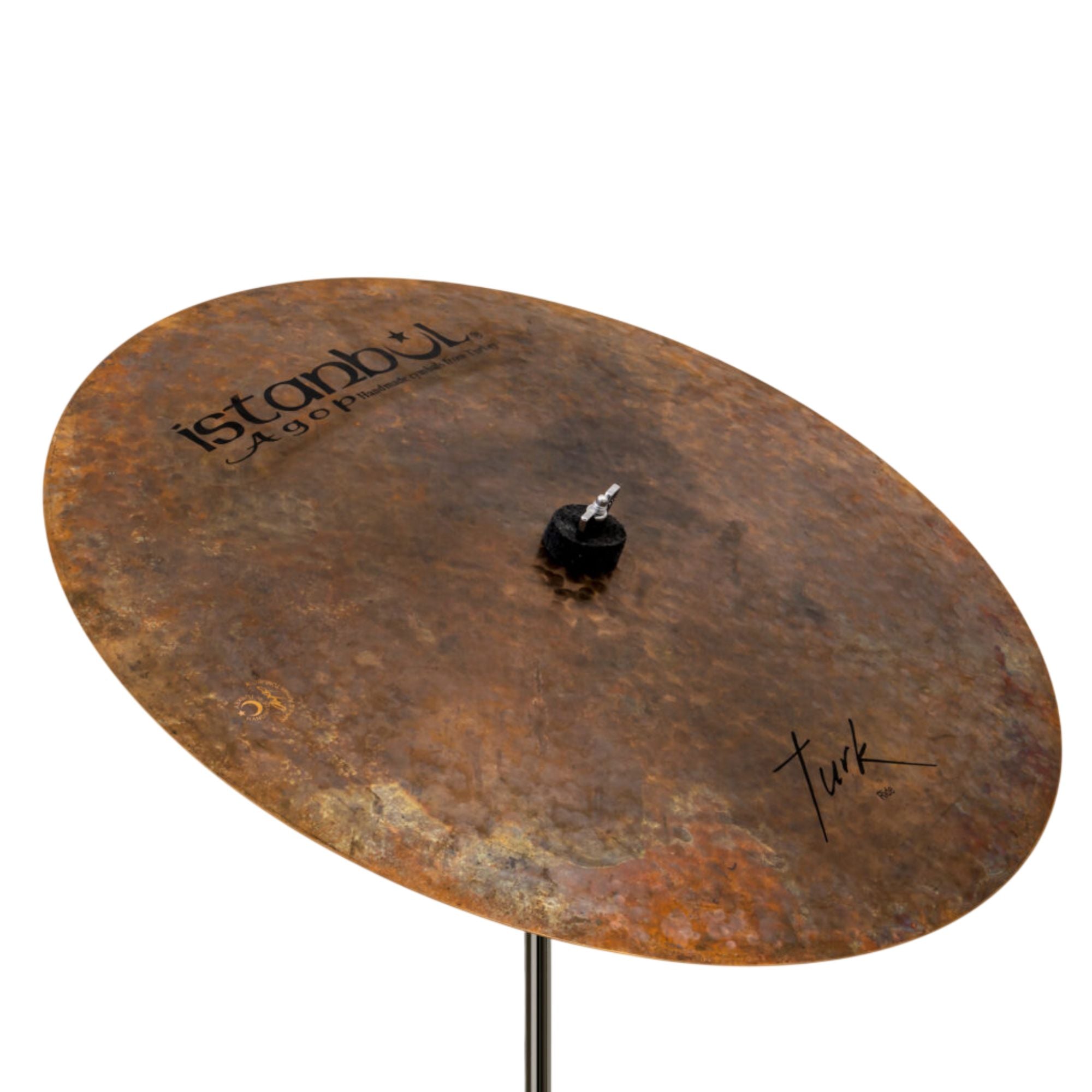 Istanbul Agop Turk Flat Ride cymbal displayed on a stand, showcasing its flat shape and metallic finish.