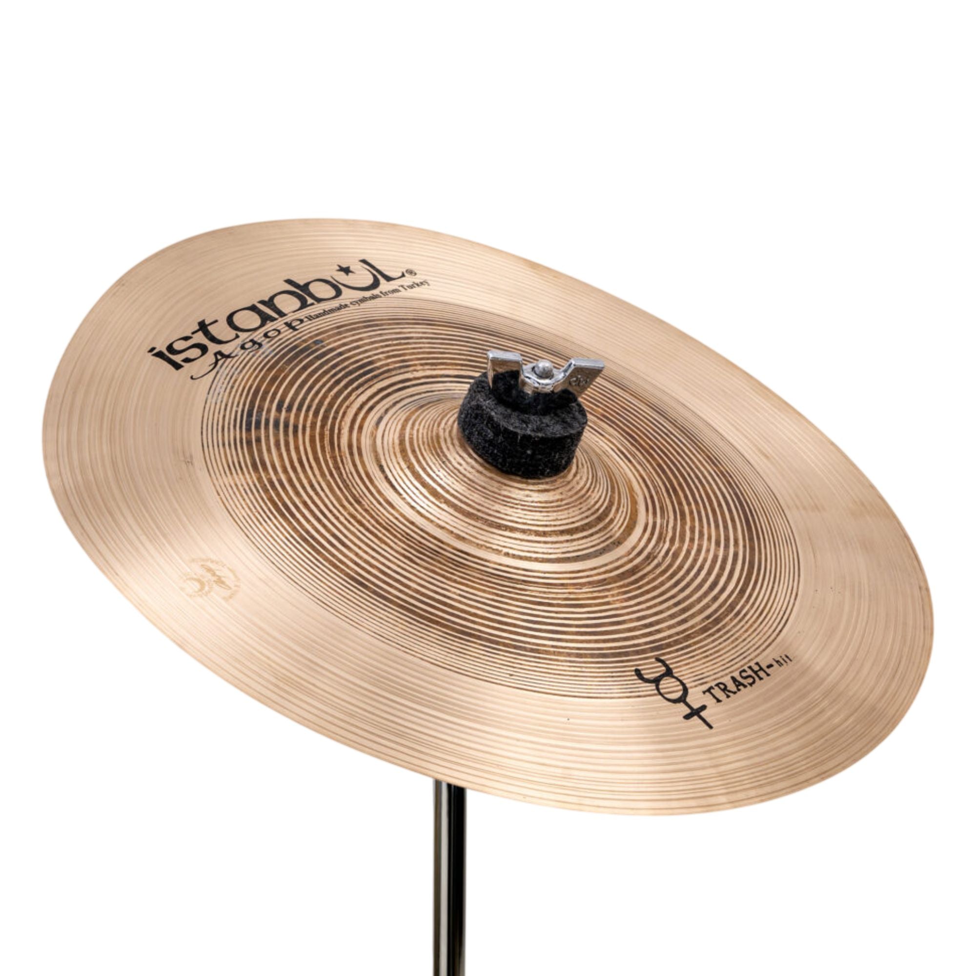 Istanbul Agop Istanbul 12-inch Traditional Trash Hit single cymbal, showing its rugged surface and distinctive shape.